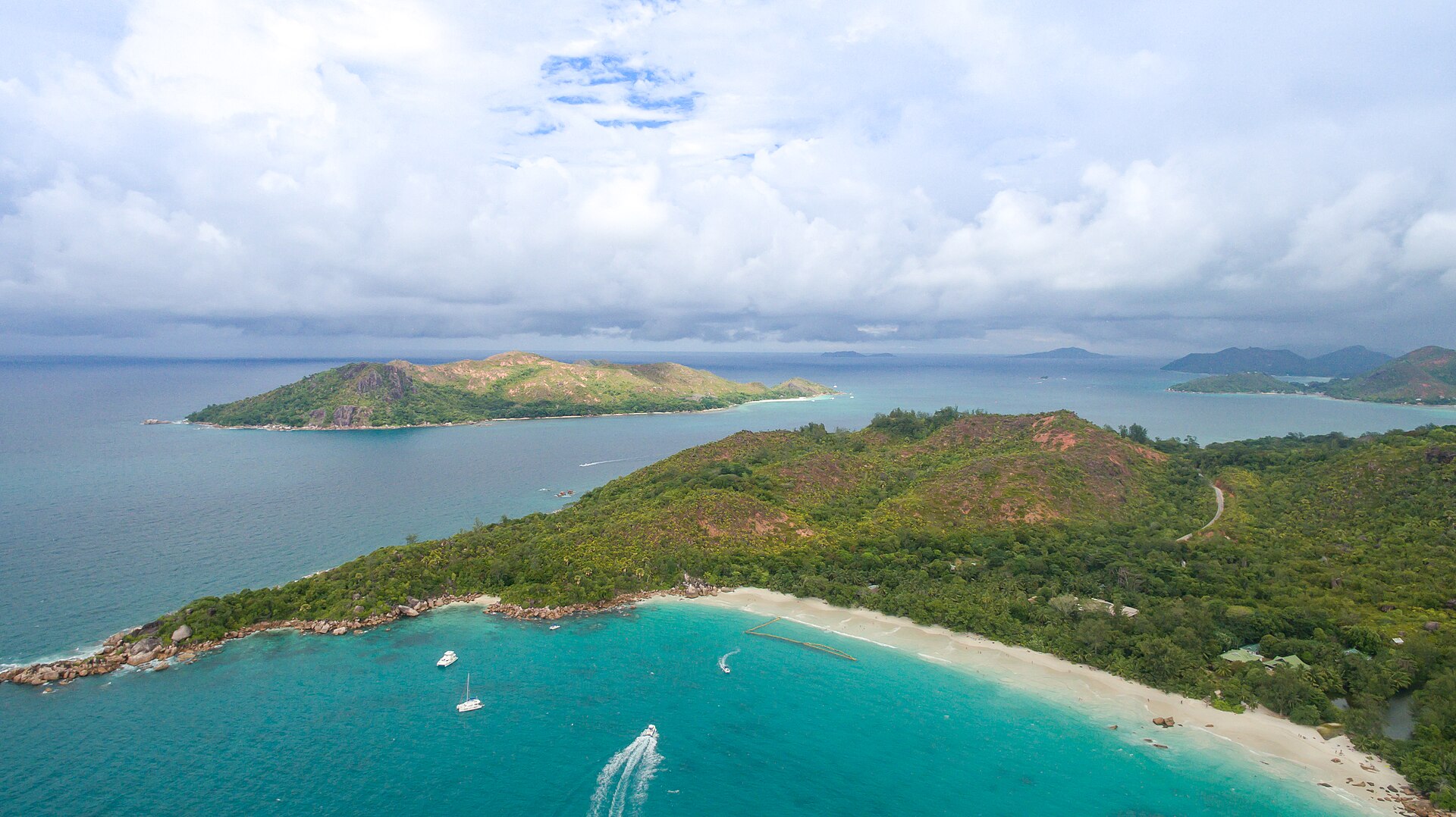 Aerial view over Anse Lazio towards the islands off Praslin