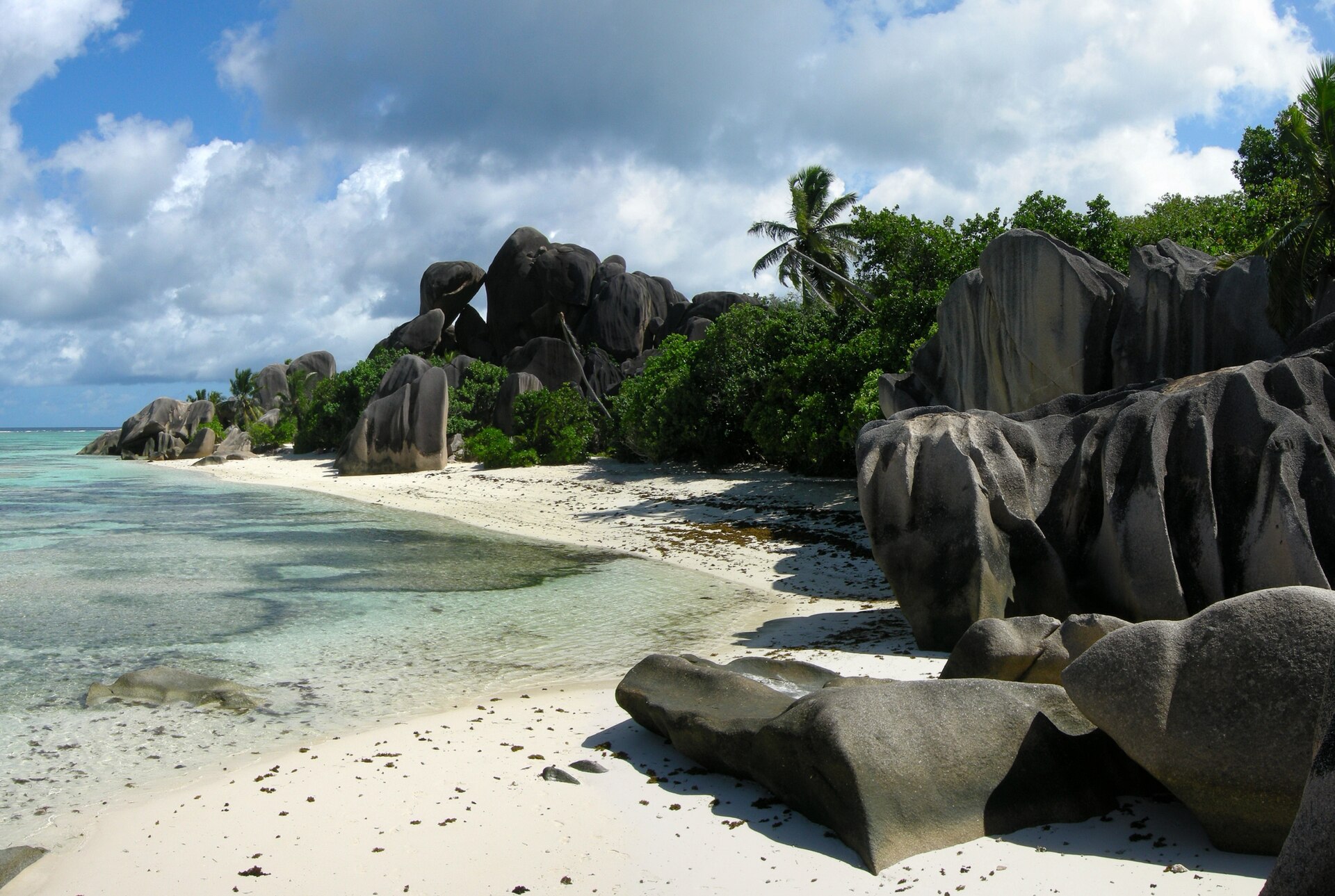 Sculpted granite boulders on the white sand of Anse Source d'Argent, La Digue