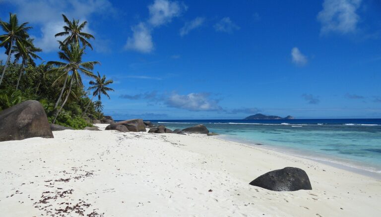 Granite rocks and white sand on the coast of Silhouette Island